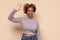 Beautiful young african american woman waving saying hello happy and smiling