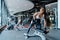 Beautiful young Asia lady exercise doing lifting barbell fat burning workout in fitness class. Athlete with six pack, Sportswoman