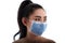 Beautiful young Asia woman putting on a medical mask to protect from airborne respiratory diseases as the flu covid-19 PM2.5 dust