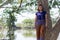 Beautiful young asia woman with tree and lagoon