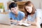 Beautiful young asian couple calculate expenses finance with laptop and planning together