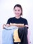 Beautiful young asian laundry holding clothing basket isolated on white background., Hold a laundry basket to wash