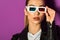 beautiful young asian woman in 3d glasses looking at camera