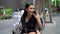 Beautiful young asian woman in black dress sitting in the coffee cafe  calling with smartphone . happy elegant lady sitting on