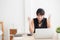 Beautiful young asian woman calculating finance household and writing notebook on desk