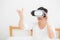 Beautiful young asian woman cheerful and fun wearing vr virtual reality headset, girl device and watching simulator game