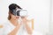 Beautiful young asian woman cheerful and fun wearing vr virtual reality headset, girl device and watching simulator game