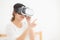 Beautiful young asian woman cheerful and fun wearing vr virtual reality headset, girl device and watching simulator game