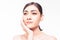 Beautiful young Asian woman with clear fresh skin touch her own face . Facial treatment, skin cleanser, cosmetology, beauty and