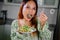 beautiful young asian woman eating healthy mediterranean food. smiling happy girl eating greek salad