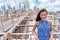 Beautiful young Asian woman portrait on Brooklyn bridge, New York city