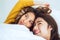 Beautiful young asian women LGBT lesbian happy couple showing surprise and looking at camera while lying in bed under blanket.