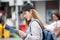 beautiful Young Asian women tourist traveler smiling with backpack on the Traffic Road using and looking at map in China town Ya