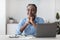 Beautiful Young Black Businesswoman Daydreaming At Workplace In Office