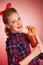 Beautiful young blond caucasian pinup woman with a glass of coc