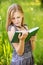 Beautiful young blond woman with book