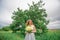 A beautiful young blonde girl collected a bouquet of wildflowers. Enjoy a walk on a warm summer day