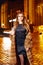 Beautiful young blonde wearing evening makeup in elegant fitting dress fashionable stylish expensive fur coat walk night stre