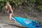 Beautiful young blonde woman kayaking on lake