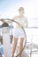 Beautiful young blonde woman, riding a boat on the water, itinerary, beautiful makeup, clothing, summer, sun, perfect body fi