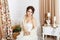 Beautiful young bride in crochet shawl and dress