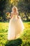 Beautiful young bride in the garden background