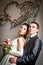 Beautiful young bride and groom in indoor setting
