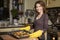 Beautiful young brunette woman in casual outfit cooking in the k