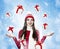 Beautiful young brunette woman with many gifts - christmas portrait
