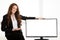 Beautiful young business woman near television screen display with copy space for additional text or graphic