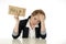 Beautiful young business woman overwhelmed and tired holding a help sign