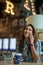 Beautiful young businessowman talking on the phone in a cafe