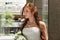 Beautiful young caucasian redhead with bouquet