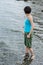 Beautiful young Caucasian woman cooling off in the lake on a summer day in Sapanca, Turkey