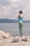 Beautiful young Caucasian woman cooling off in the lake on a summer day in Sapanca, Turkey