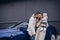 Beautiful young couple charges an electric car.