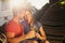 Beautiful young couple on hammock toasting wine.