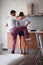 Beautiful young couple having fun while making breakfast in modern kitchen. lifestyle, modern, young adults, casual, living