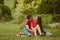 Beautiful young couple in love decided to have a romantic picnic in the park. A date, time spent together is priceless. Camping in