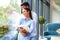 Beautiful young couple standing at the window and relaxing