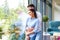 Beautiful young couple standing at the window and relaxing