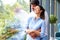 Beautiful young couple standing at the window and relaxing