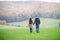 Beautiful young couple on a walk. Colorful autumn nature.