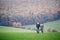 Beautiful young couple on a walk. Colorful autumn nature.