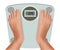 Beautiful young feet on the scale. Concept of diet