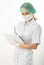 Beautiful young female doctor in medical gown and