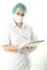 Beautiful young female doctor in medical gown and