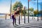 Beautiful  young female doing exercises on the street of the playground. Concept of good physical shape and healthy lifestyle