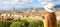 Beautiful young female model with hat in the city of Florence with the Cathedral and Palazzo Vecchio palace on the background,