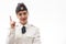 Beautiful young female Russian police officer in dress uniform shows signs with her hands on a white background